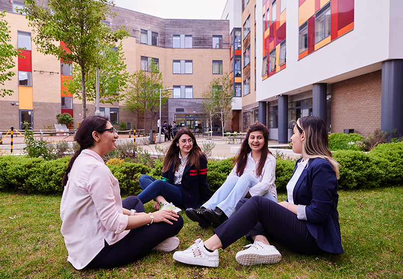 Students Relax In The Abbey College Cambridge Courtyard